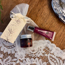 Cosmetic products on a lace doily with a wooden surface