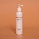 White bottle with pump labeled 'tiberiver' on an orange background