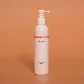 White bottle with pump labeled 'tiberiver' on an orange background