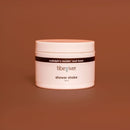 Jar of 'tiberiver' shower shake on a brown background