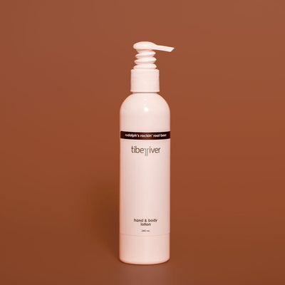 White bottle with pump on a brown background