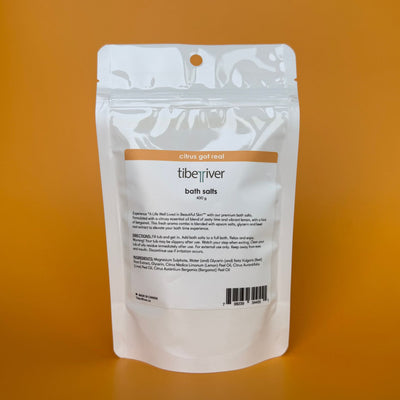 White packaging of Tiberiver bath salts on an orange background