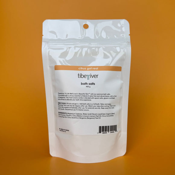 White packaging of Tiberiver bath salts on an orange background