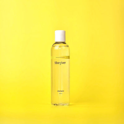 Yellow bottle of LibeRives shampoo on a yellow background