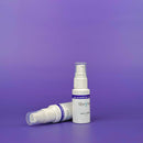 Two white spray bottles with 'tiberius' branding on a purple background